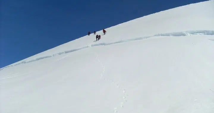 Group of people coming down the Hrútfjallstindar Peaks in the Vatnajokull glacier