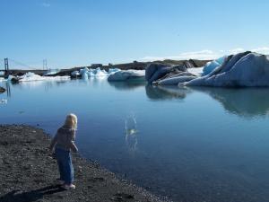 Little girl and and a massive glacial lagoon.
