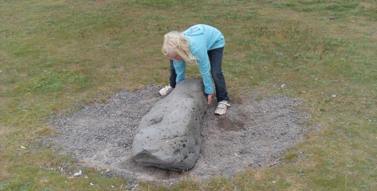 When not busy chasing catfish fishermen would compete in lifting boulders. Or so the story goes. Here is a budding fisherwoman lifting one.