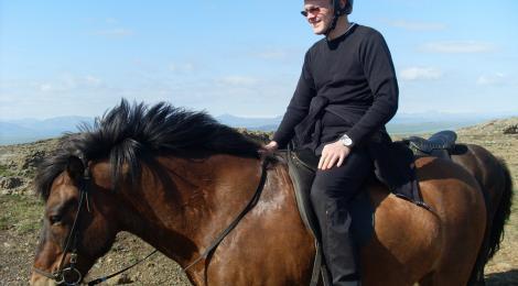 The author looking pleased with himself. The horse is probably just counting the minutes until it gets back to the pasture. 