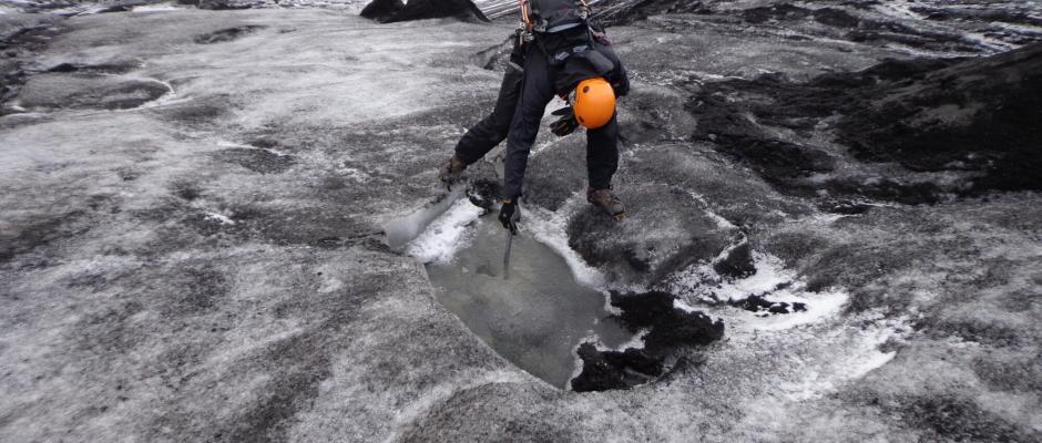 Our guide, Birgir, shows us a murderous sinkhole. You do not want to step into that. 