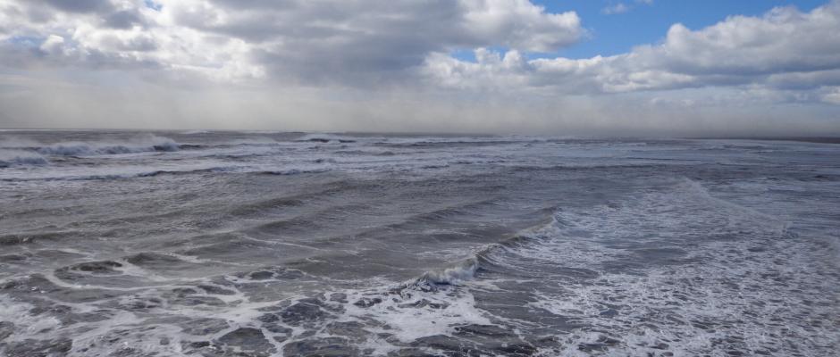 Heavy waves and stormy skies at Landeyjarhöfn harbour