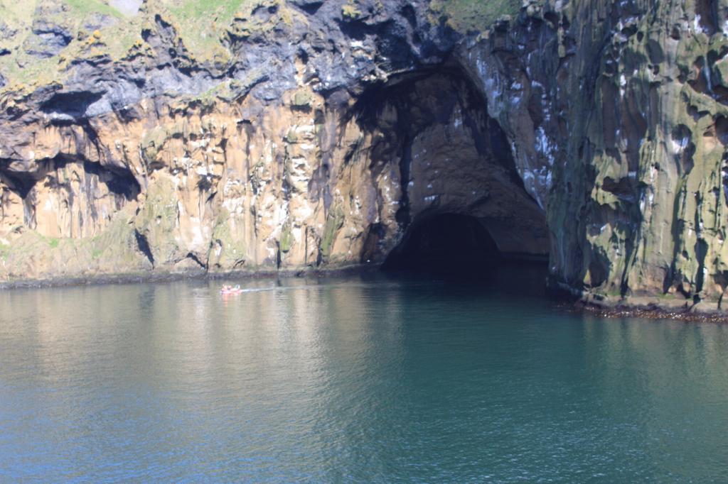 Azure seas and hidden cave in the Vestman islands.