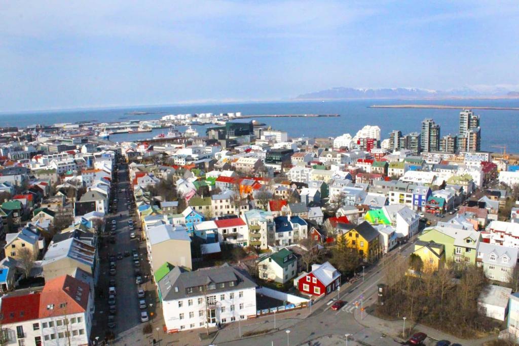 Quiet and peaceful during the day, but sometime in the period between evening and night, the streets come alive, and the nightlife becomes as colourful as the rooftops of Reykjavik’s buildings.