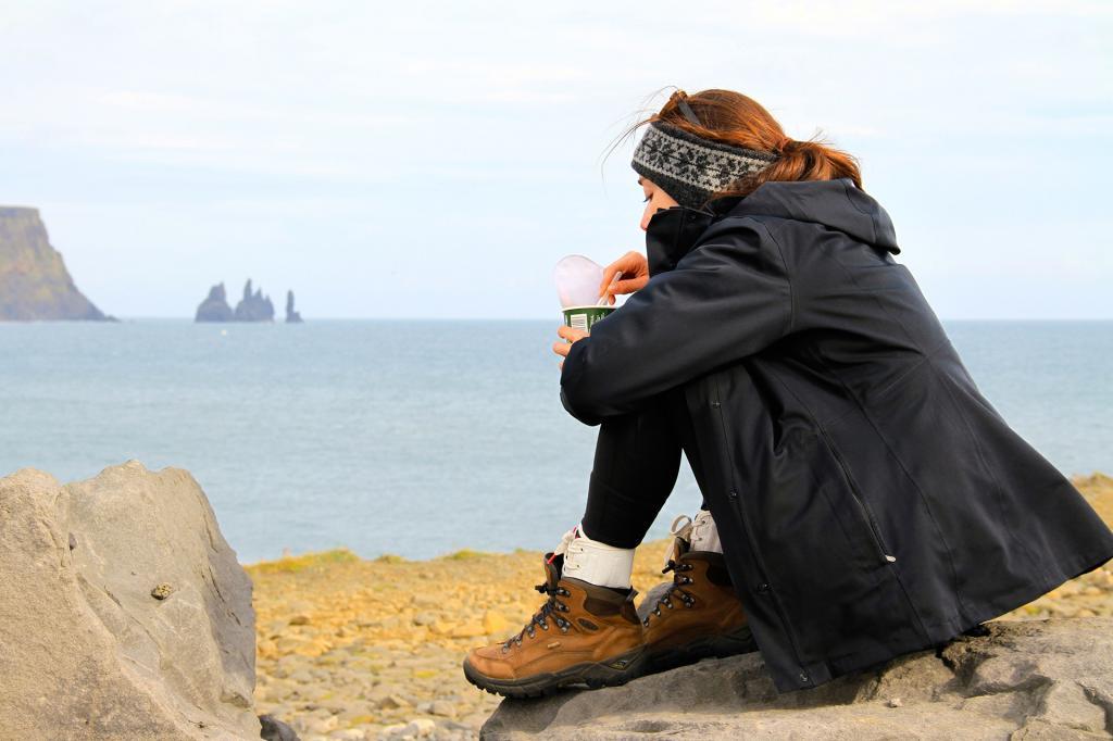 Enjoying a snack and the view at Dyrholaey.