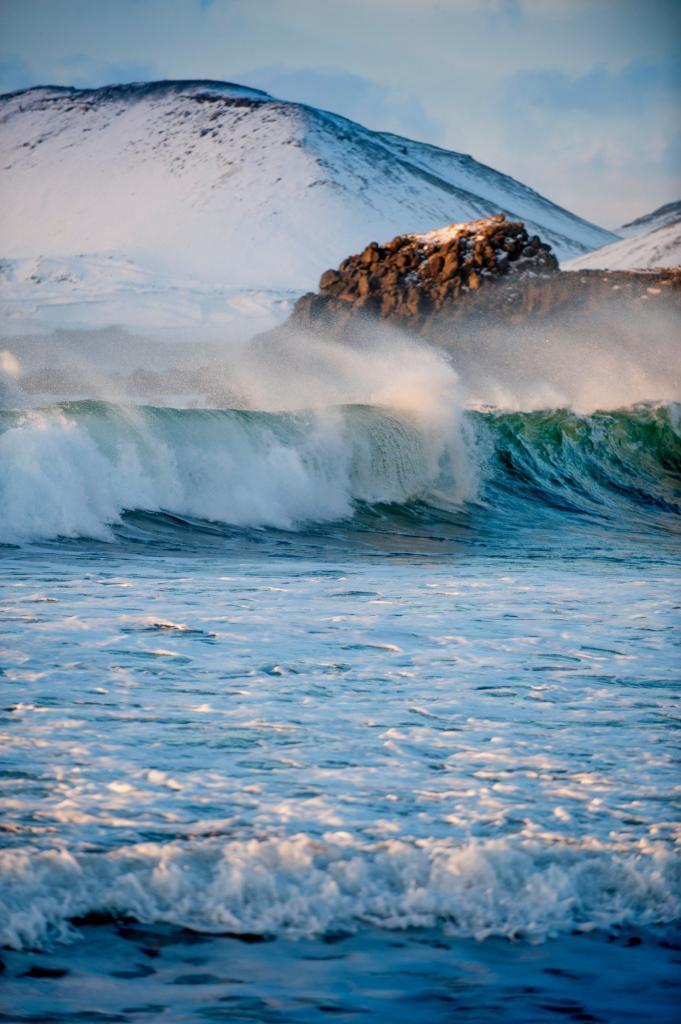 Mighty waves pound the southern coast of Iceland.