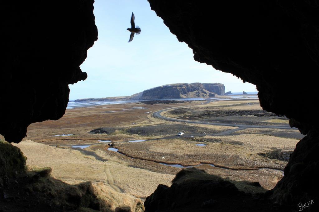 Dyrholaey seen from Loftsalahellir cave. 