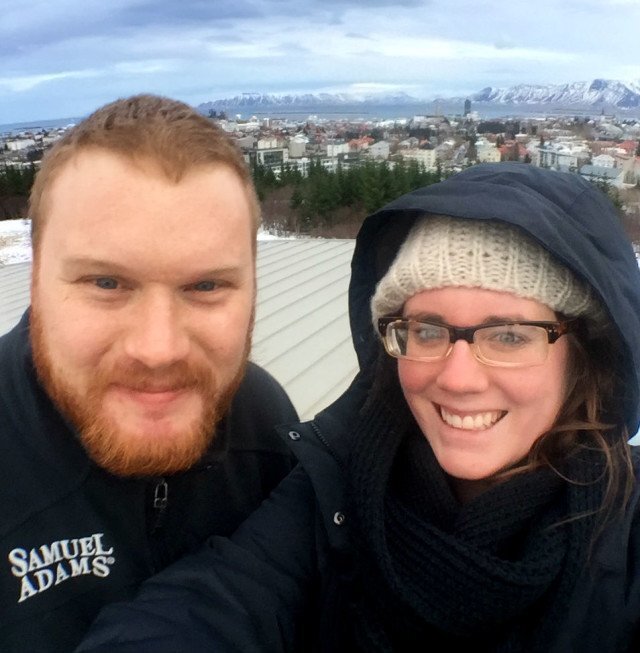Eileen and her husband Christian buffeted by Icelandic gale at the observation deck of the Pearl in Reykjavik. But still smiling somehow.