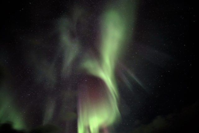 Icelandic northern lights light up the sky. 