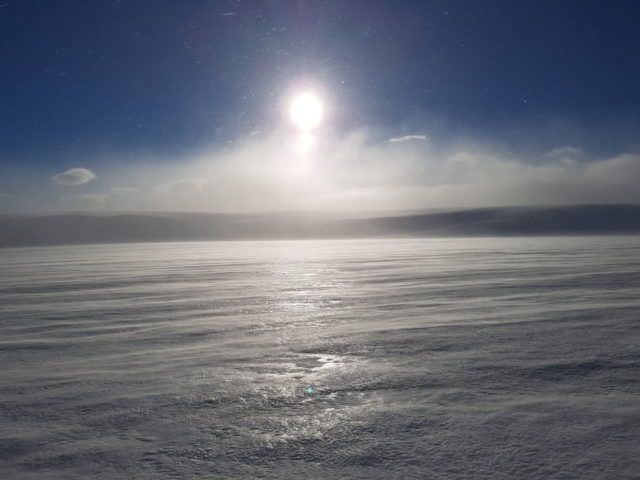 The weather begins to change. Snowdrifts blow across the ice sheets of Langjökull glacier.