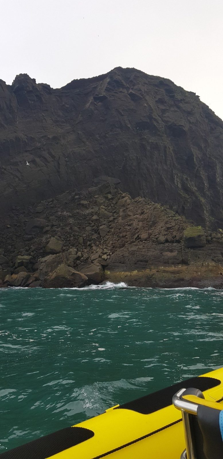 Giant rockslide at the Bjarnarey island in the Westman Islands archipelago