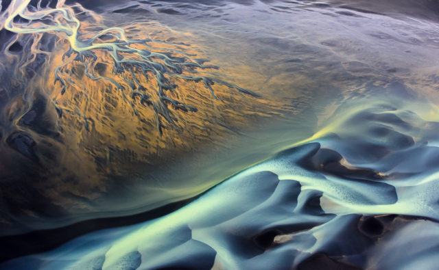 Two rivers meet forming a surreal palette of color. Photo by Tom A. Warner.