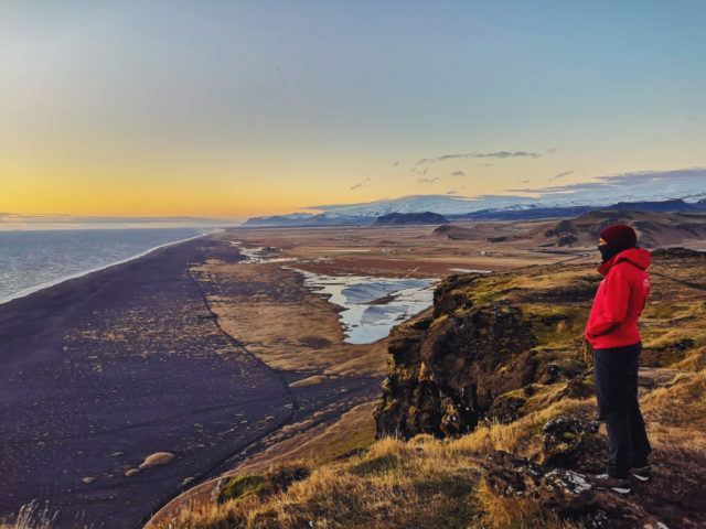 Photographer Mehdi Giaimo by a black beach in Iceland.