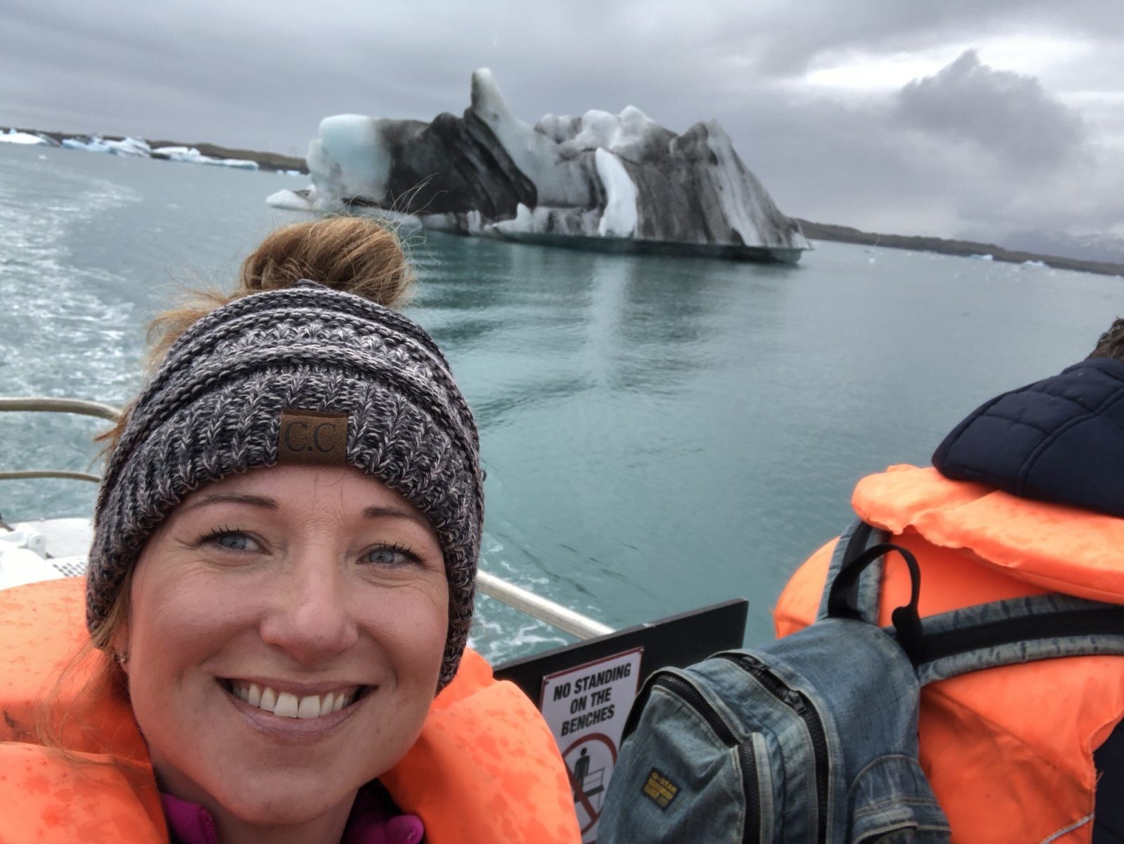 Lady in the glacier lagoon in Iceland.