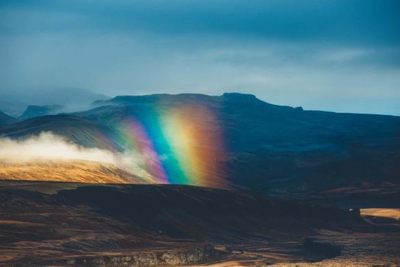 Rainbow in Iceland. This article answers the question how to save on my trip to Iceland