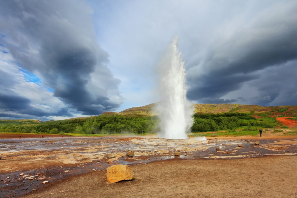 The geyser Strokkur erupts in Iceland.