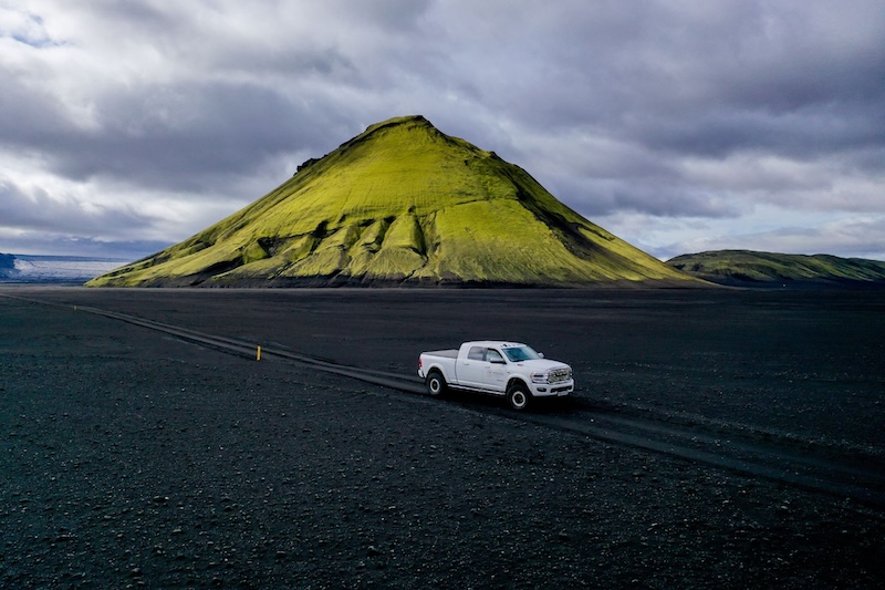 A Midgard truck next to the lonely mountain of Mælifell in the Icelandic highlands.