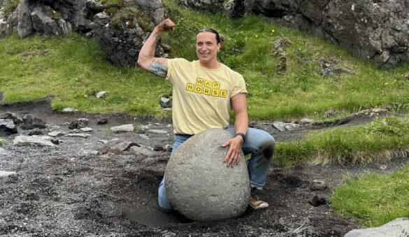 Sanda "Sunny" Bradley with one of the lifting stones in Iceland.