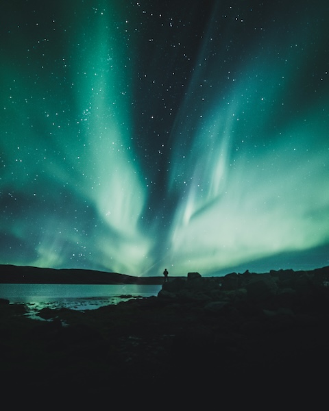 Seeking the northern lights in Iceland can be very rewarding. Photo by Luke Stackpoole on Unsplash.