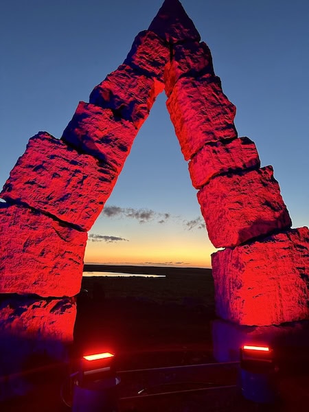 Lights play with the sunset at the Artic Henge.