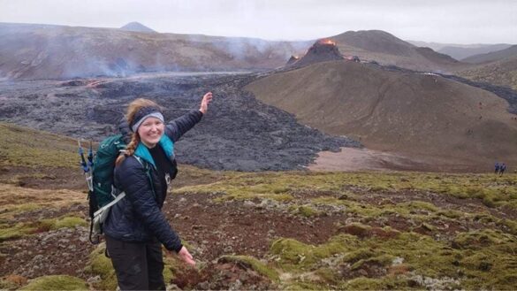 Rebecca Kent demonstrates the incredible amount of lava generated by one of the recent eruptions on the Reykjanes peninsula.