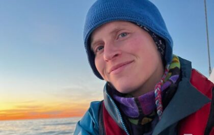 Artist and world traveler Kathrarina enjoys a sunset in Greenland.