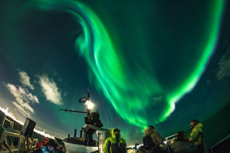 The northern lights shimmer in the Icelandic winter sky.